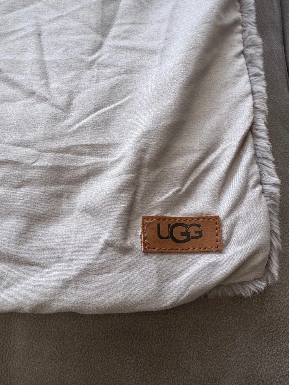 UGG gray faux fur pillow cover. Hidden zipper edge. Approximately 26 x 19.5 inch